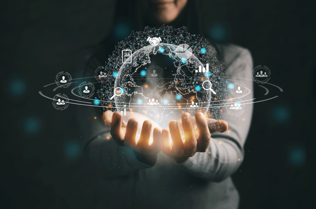 Woman holding a transparent globe with data icons around it